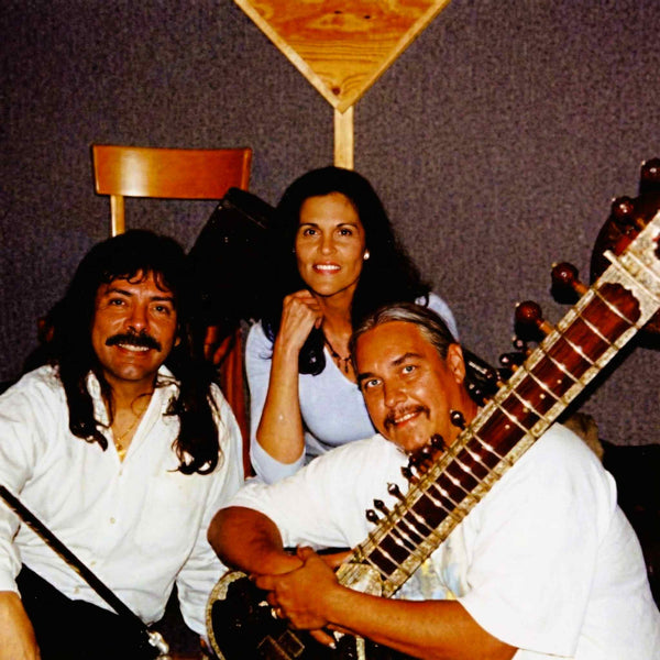 Shawn Rae with Stephen Mikes and Patricia Young posing together with sitar musical instrument